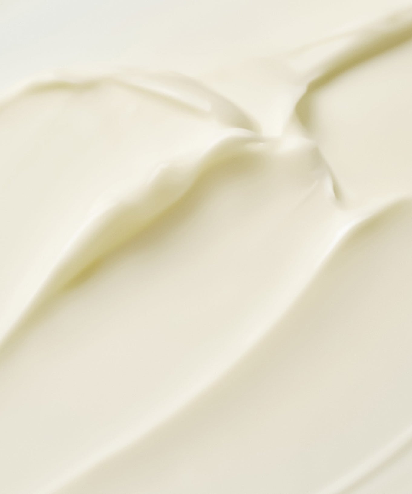 Texture of PURITO Timeless Bloom Retinol Spot Cream 30ml cream swatch, showing smooth and creamy application.