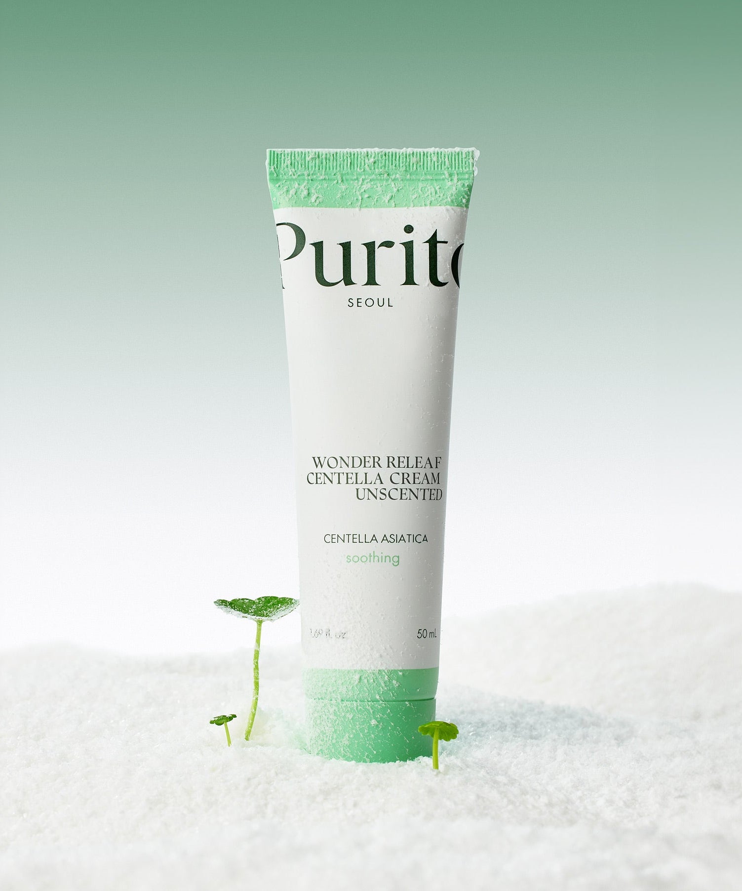 PURITO Wonder Relief Centella Cream Unscented 50ml tube on a textured surface with green accents