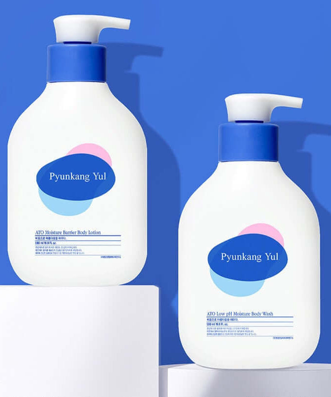 PYUNKANG YUL Ato Moisturizing Barrier Body Lotion 590ml and Moisture Body Wash bottles on a blue background