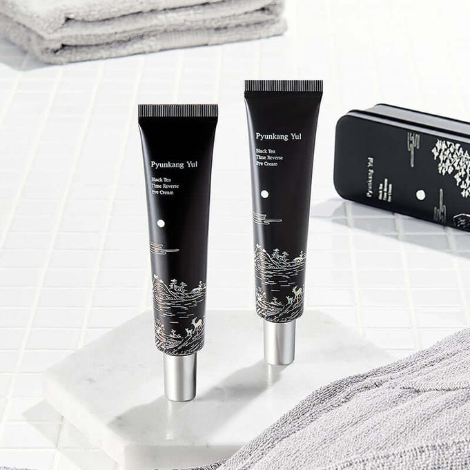 PYUNKANG YUL Black Tea Time Reverse Eye Cream 25ml tubes on white surface for anti-aging skincare