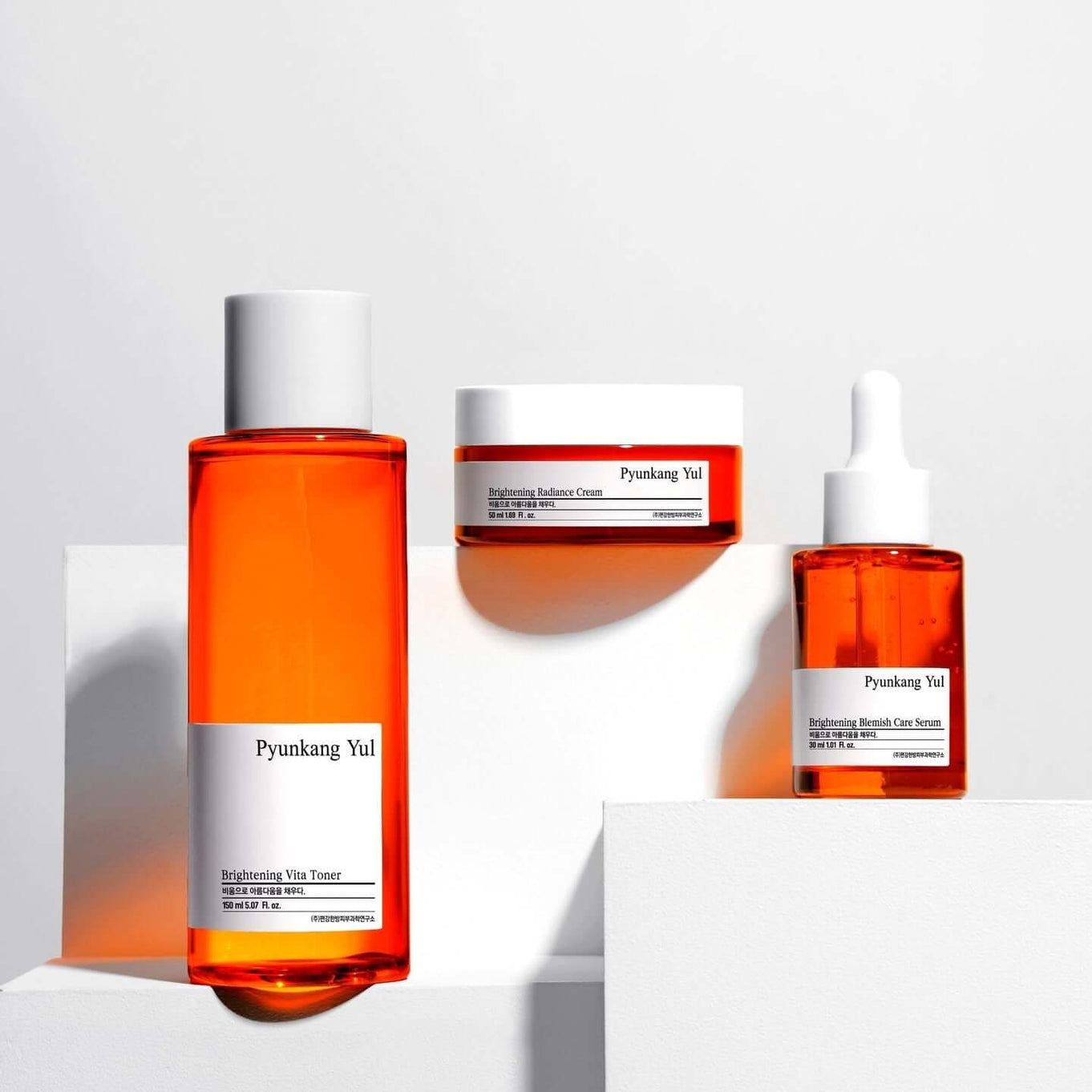 PYUNKANG YUL Brightening Bojagi Gift Set display with toner, cream, and serum bottles.