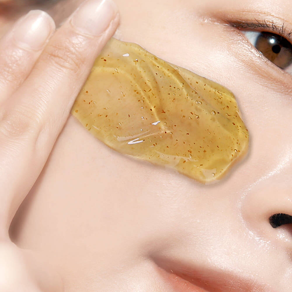 Person applying PYUNKANG YUL Calming Relief Gel Wash-Off Pack 100g to skin, showcasing texture and application.