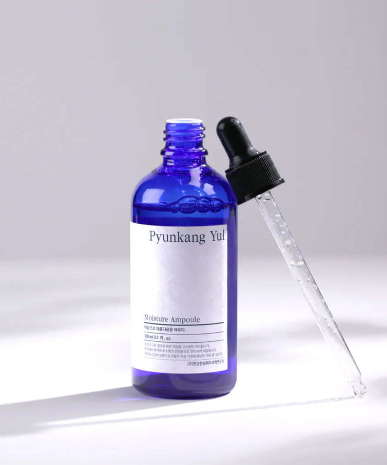 PYUNKANG YUL Moisture Ampoule 100ml with blue bottle and dropper for hydrating skincare.