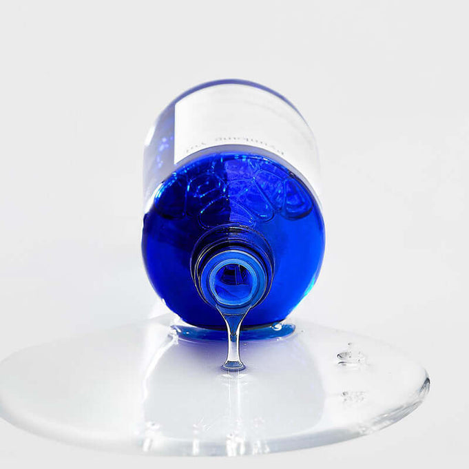 PYUNKANG YUL Moisture Ampoule 100ml bottle with liquid pouring out.