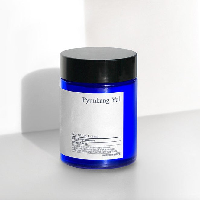 PYUNKANG YUL Nutrition Cream 100ml in blue jar with black lid, nourishing cream with shea butter and antioxidants for skin hydration.
