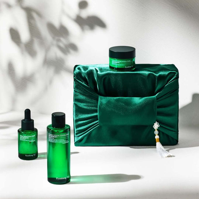 PYUNKANG YUL Ultimate Bojagi Gift Set displayed elegantly with green packaging and beauty products.