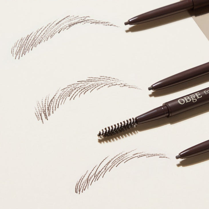 OBGE Easy Pencil Bro eyebrow pencil and spoolie set on paper with brown eyebrow strokes — Gentleman Korea Korean men’s grooming product