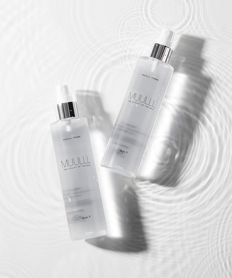 Two bottles on water surface, not related to QUA-T Petavegan Large Capacity Toner 300ml.