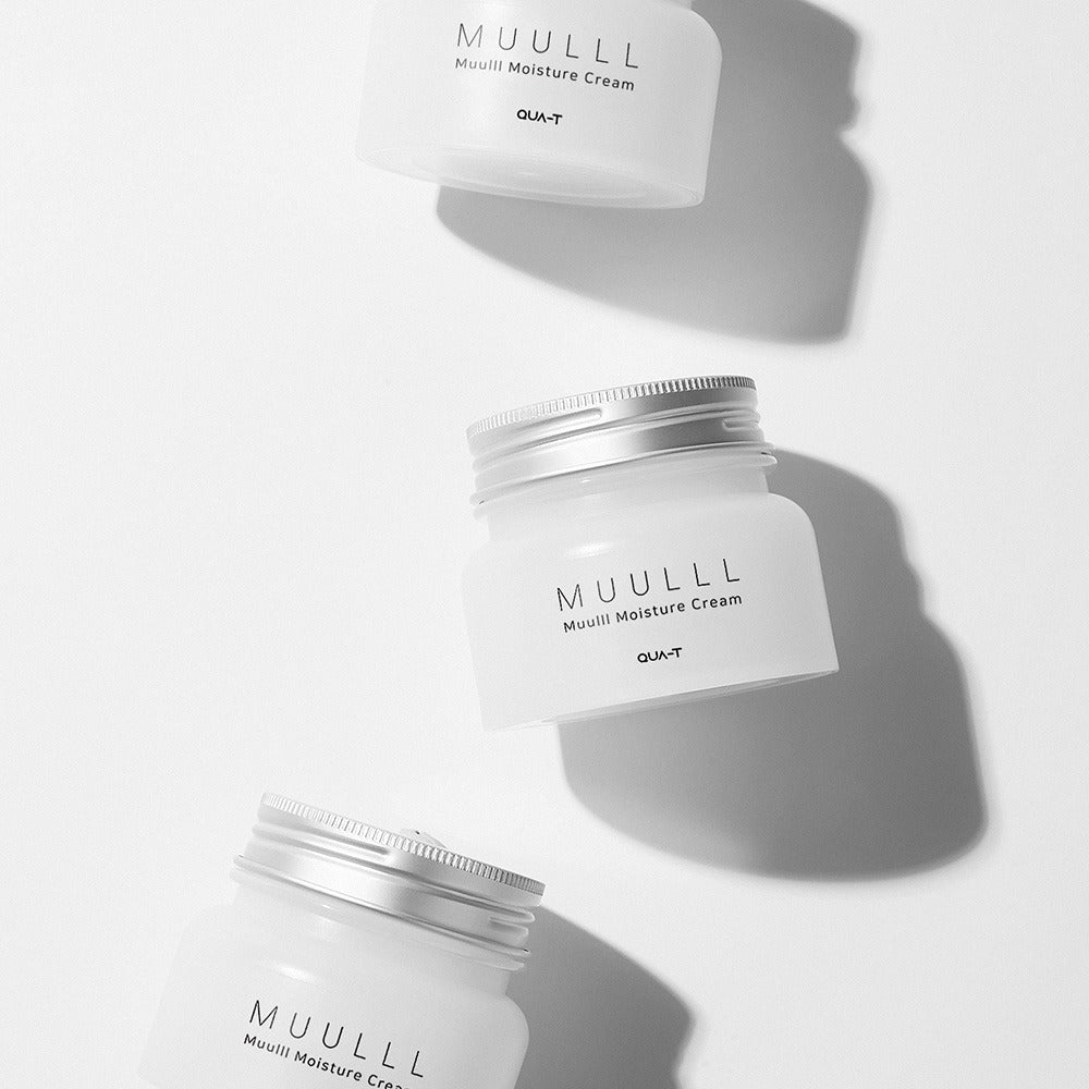 Three jars of QUA-T Subuji Moisture Cream 100ml, arranged artistically.
