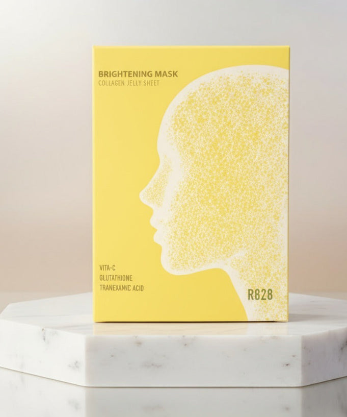 R828 Brightening Mask Pack (5 pieces) on a marble table, featuring yellow packaging with a profile silhouette.