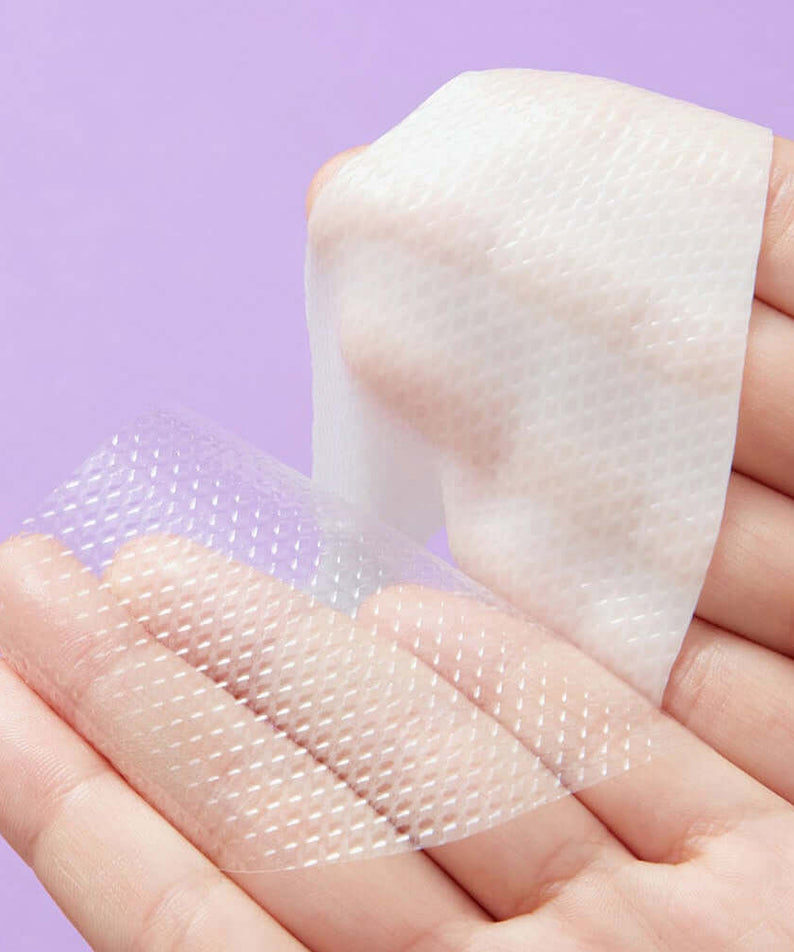 Close-up of REAL BARRIER Retinol Pore Tightening Serum Gel Mask x5 Sheets on a hand demonstrating its texture and design.