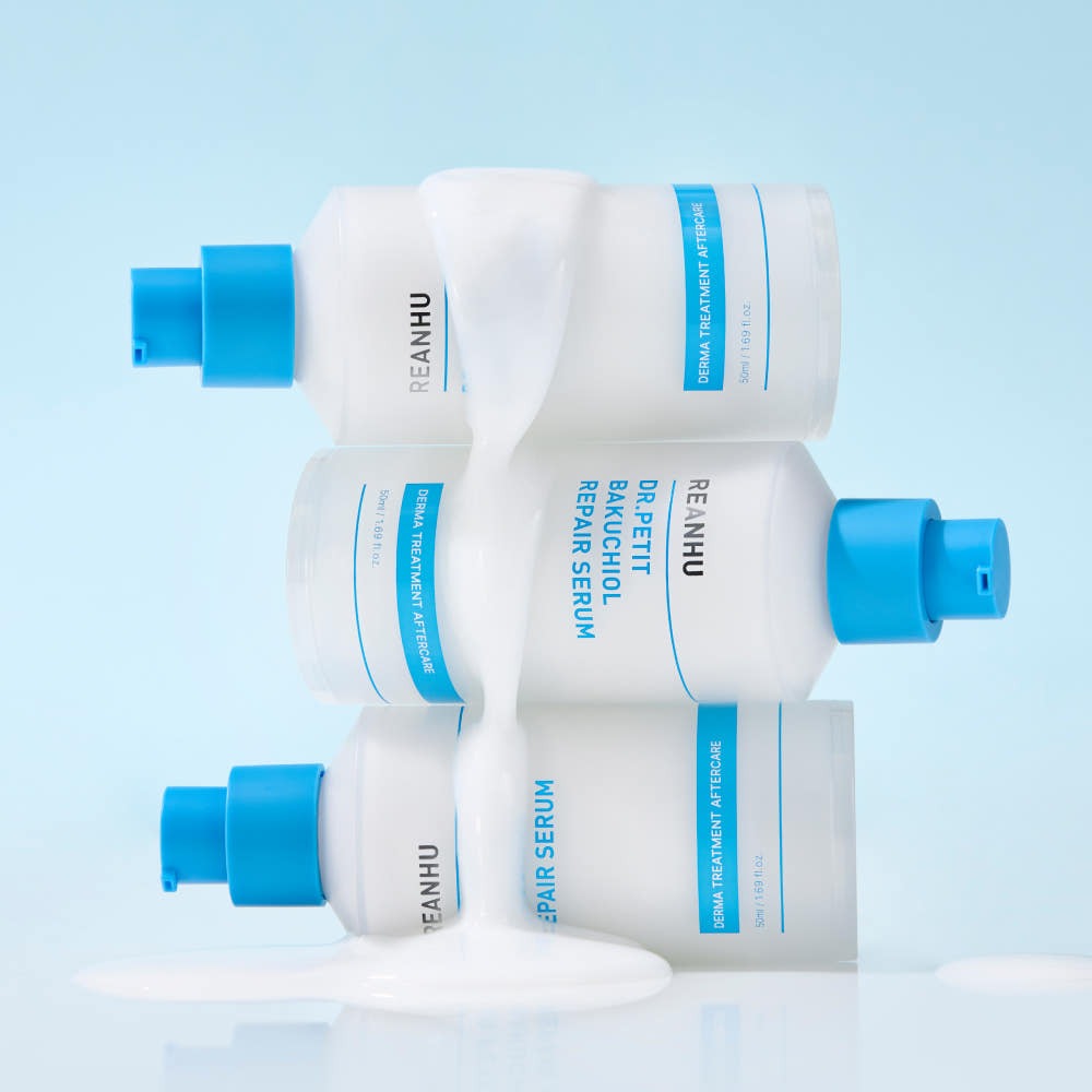REANHU DR.PETIT Bakuchiol REPAIR Serum 50ml stacked bottles on blue background for Gentleman Korea Korean men's skincare