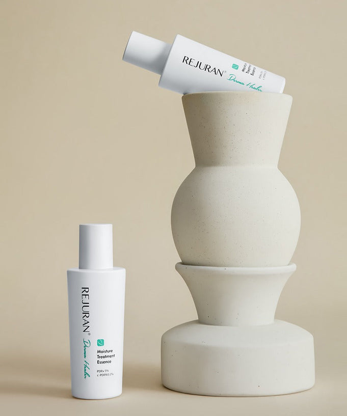 REJURAN Derma Healer Moisture Treatment Essence 70g bottles displayed next to modern vase