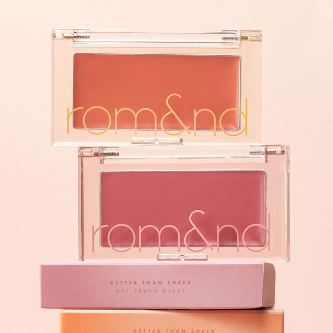 ROMAND better than cheek #glaze blushes displayed with packaging, highlighting the peach and pink shades.