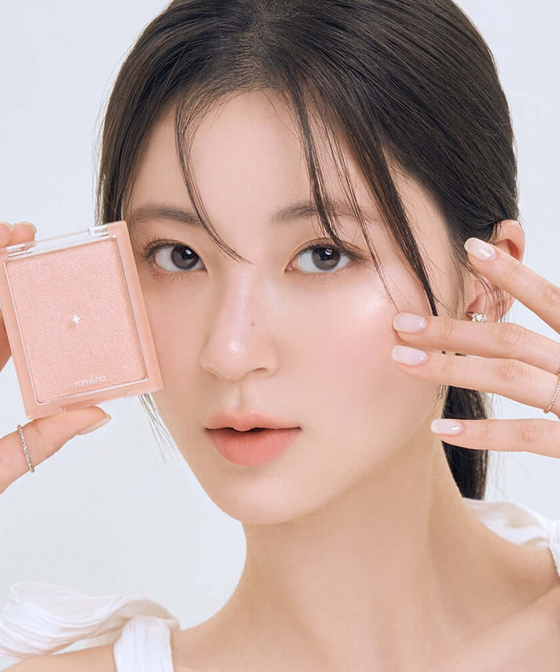 Model showcasing ROMAND see-through veil lighter makeup product close-up