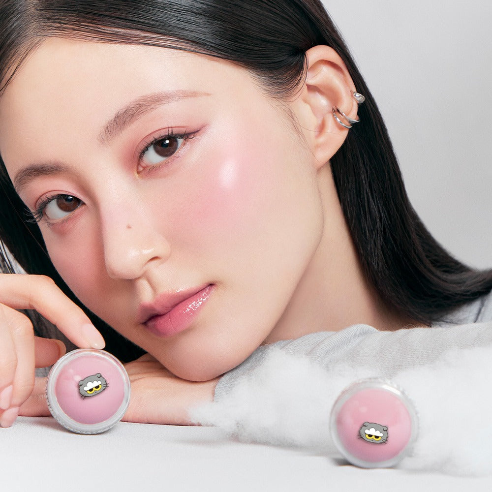 Model showcasing ROMAND x Joanne Friends Juicy R Cheek (Special Set) with pink blush and stylish earrings.