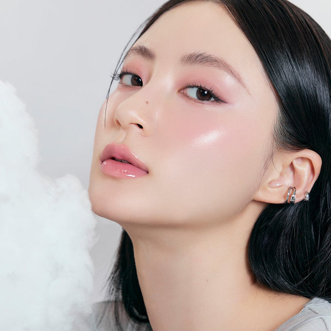 Model wearing ROMAND x Joanne Friends The Juicy Lasting Tint, showcasing a dewy makeup look with glossy lips and soft eye makeup.