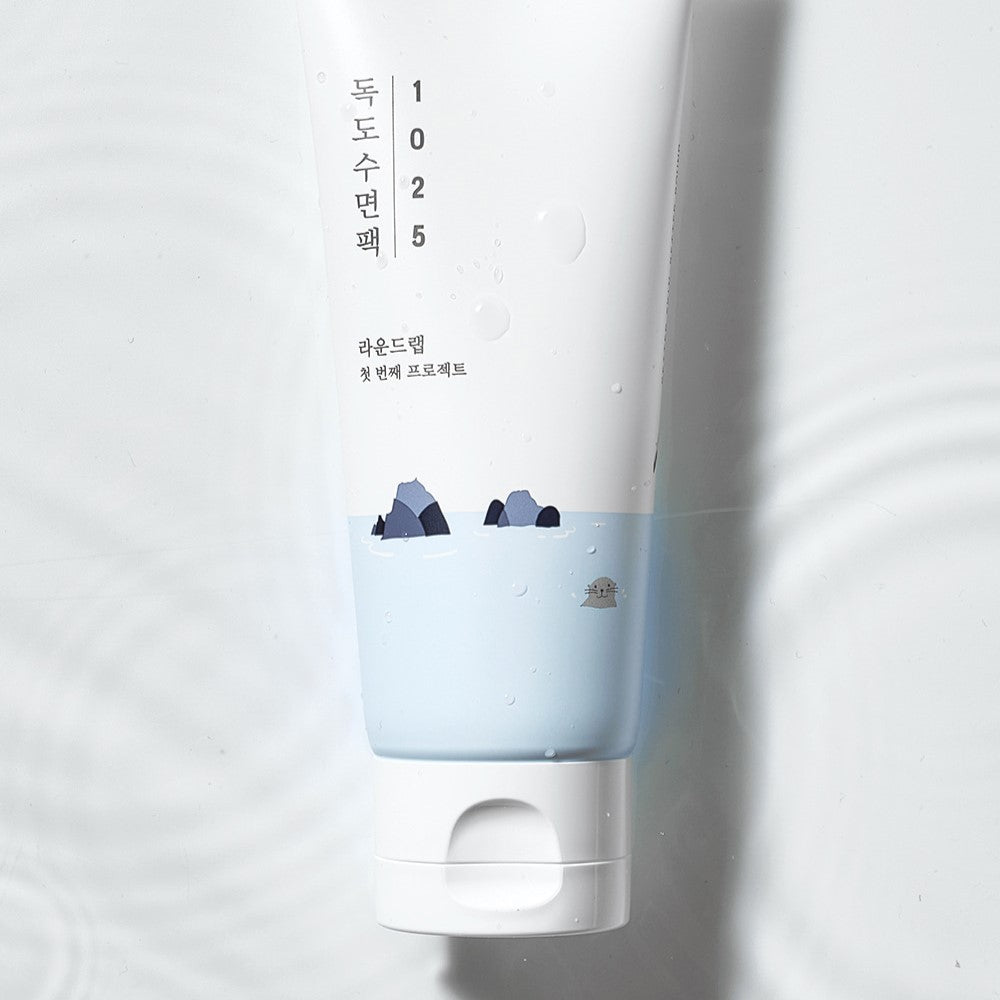ROUND LAB 1025 Dokdo Sleeping Pack 100ml tube design with calming blue and white theme on water background