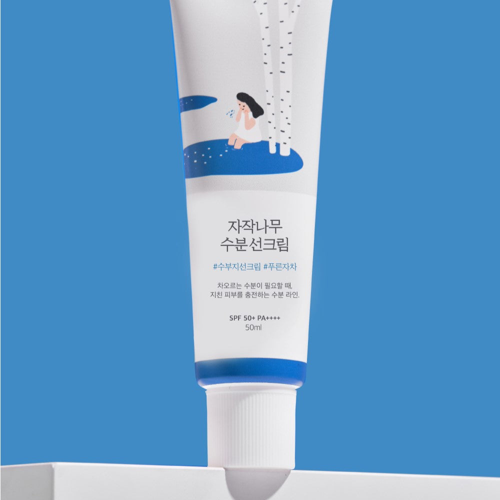 ROUND LAB Birch Juice Moisturizing Sunscreen 50ml on blue background