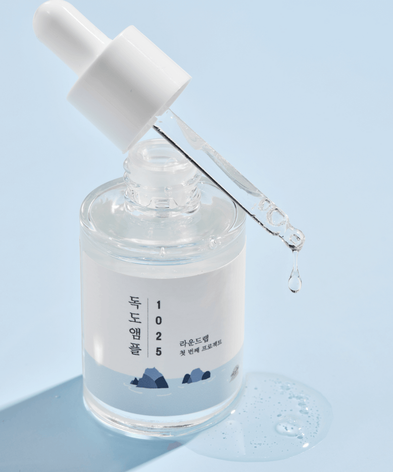 ROUND LAB 1025 Dokdo Ampoule 45g with dropper, emphasizing skincare benefits.