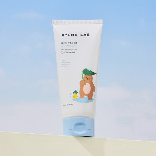 ROUNDLAB Baby Mild Cream 200ml packaging against a blue sky background