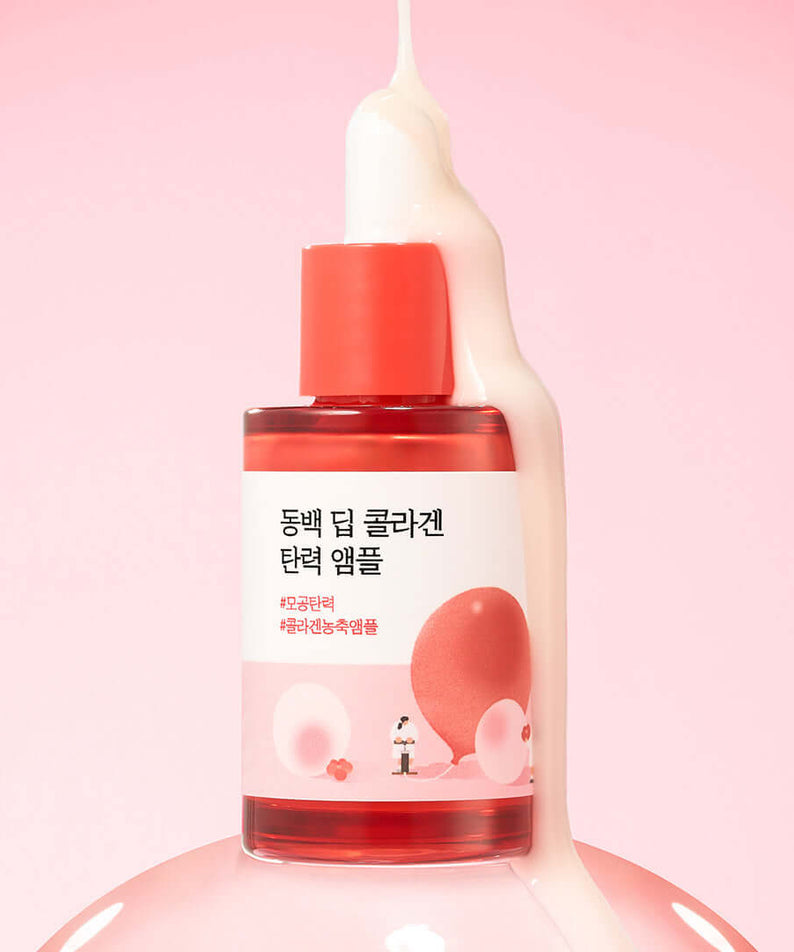 ROUND LAB Dongbeak Deep Collagen Elasticity Ampoule 30ml bottle against pink background with cream dripping from above