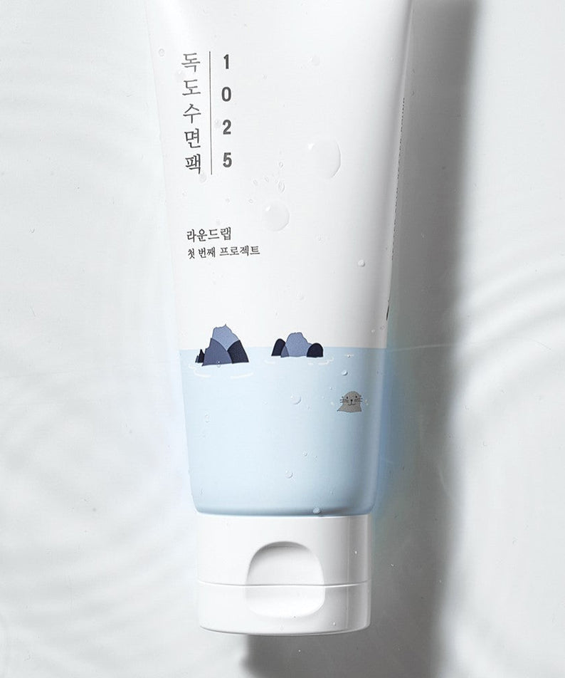 ROUND LAB 1025 Dokdo Sleeping Pack 100ml tube design with calming blue and white theme on water background