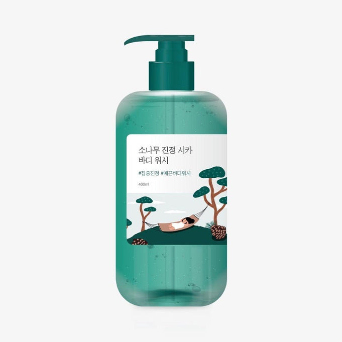 Image of ROUND LAB Pine Calming Cica Body Wash 400ml in a green bottle with a relaxing design.