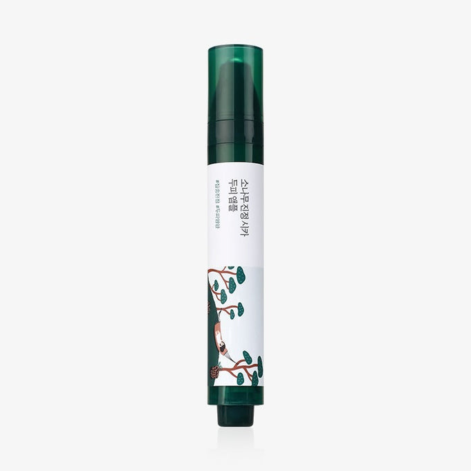 Bottle of ROUND LAB Pine Soothing Cica Scalp Ampoule 15ml with green and white design