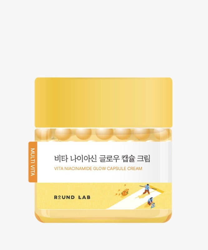 Image of ROUND LAB Vita Niacin Glow Capsule Cream 50ml in yellow packaging, highlighting the product's brightening and nourishing benefits.
