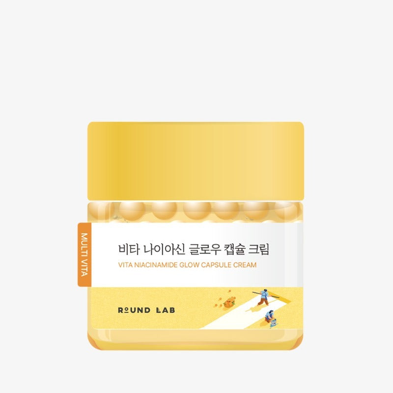 Image of ROUND LAB Vita Niacin Glow Capsule Cream 50ml in yellow packaging, highlighting the product's brightening and nourishing benefits.