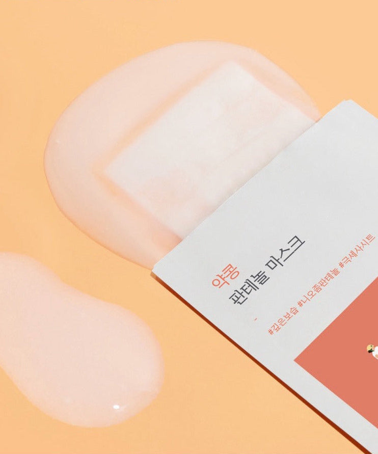 ROUND LAB Yakkong Panthenol Mask (10 sheets) with pink essence on orange background.