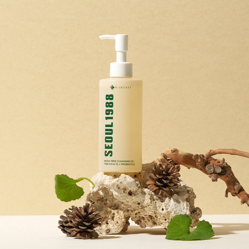 SEOUL 1988 Pine Cica Cleansing Oil bottle on natural stone surface with pine cones and leaves