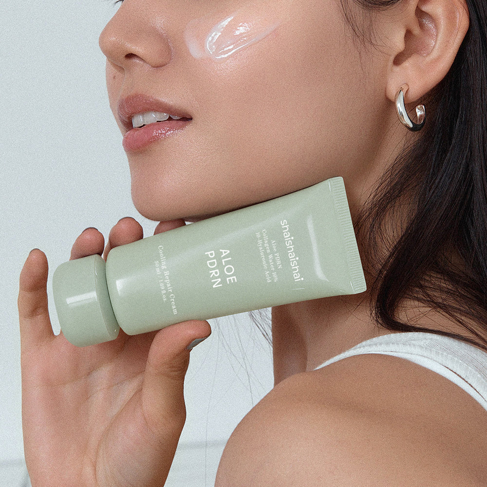 Woman applying SHAISHAISHAI [1+] Aloe PDRN Cooling Repair Cream 50ml on face