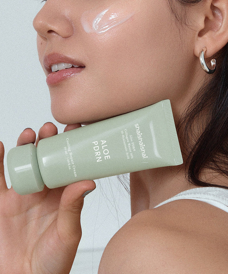 Woman applying SHAISHAISHAI [1+] Aloe PDRN Cooling Repair Cream 50ml on face