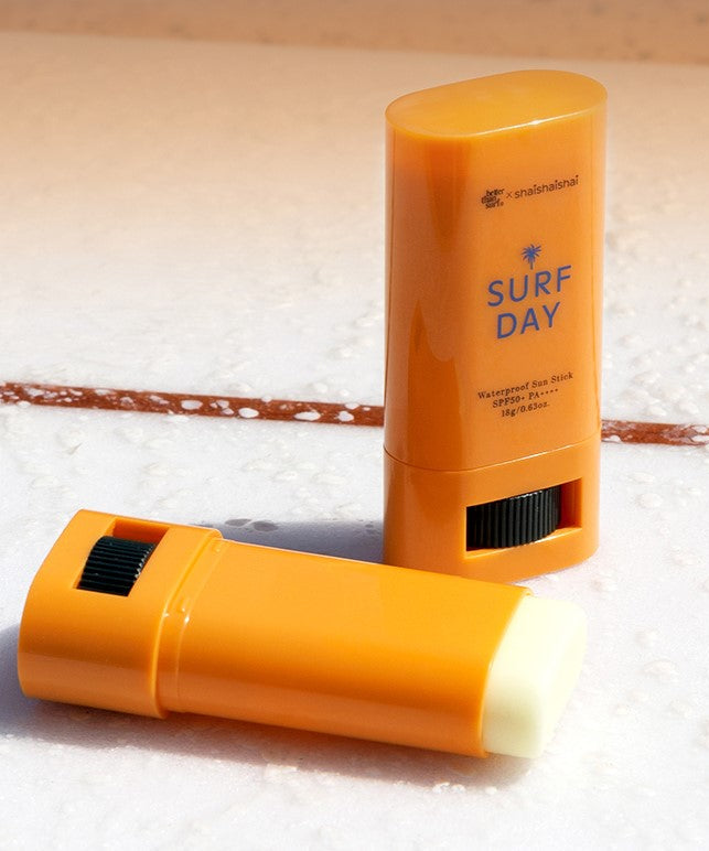 SHAISHAISHAI Surf Day Waterproof Sun Stick SPF50+ PA++++ 18g on sandy beach surface