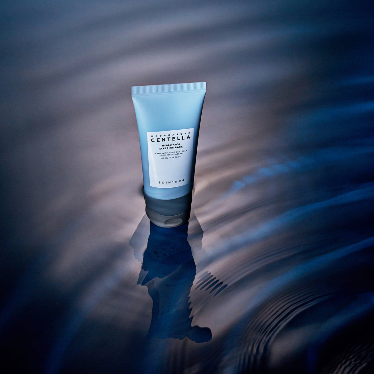 SKIN1004 Madagascar Centella Hyalu-Cica Acid Sleeping Pack 100ml in a serene blue water background.