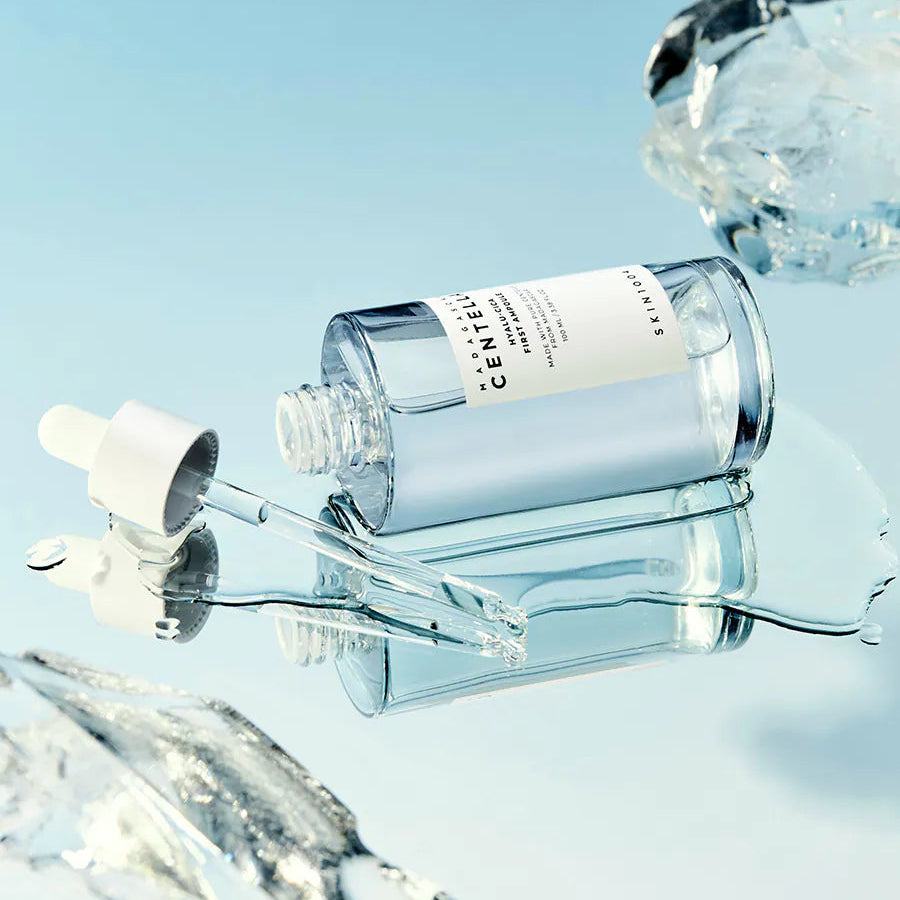 SKIN1004 Madagascar Centella Hyalu-Cica First Ampoule 100ml bottle with dropper on ice background