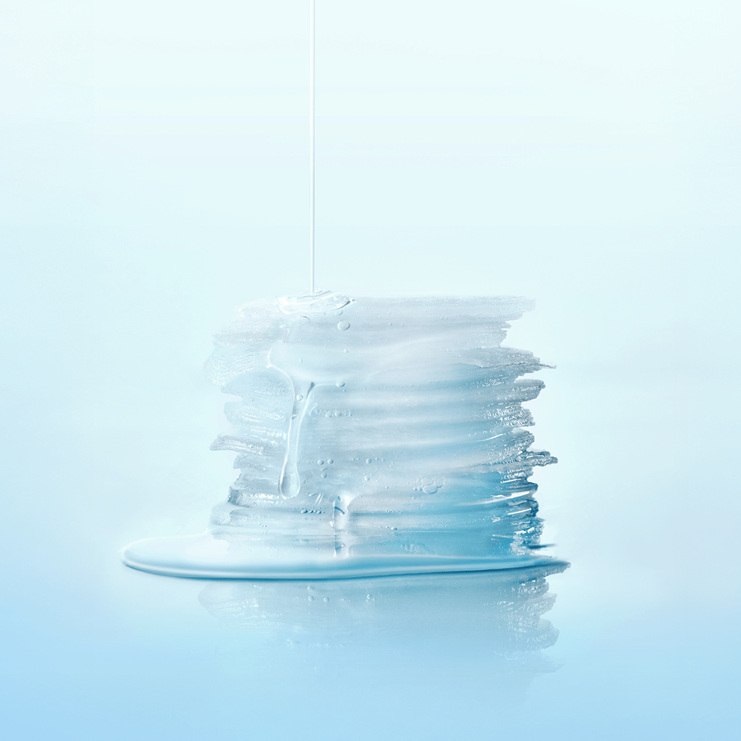 Stack of SKIN1004 Madagascar Centella-Hyalu-Cica Jelly Fit Ampoule Pads with serum on blue background.