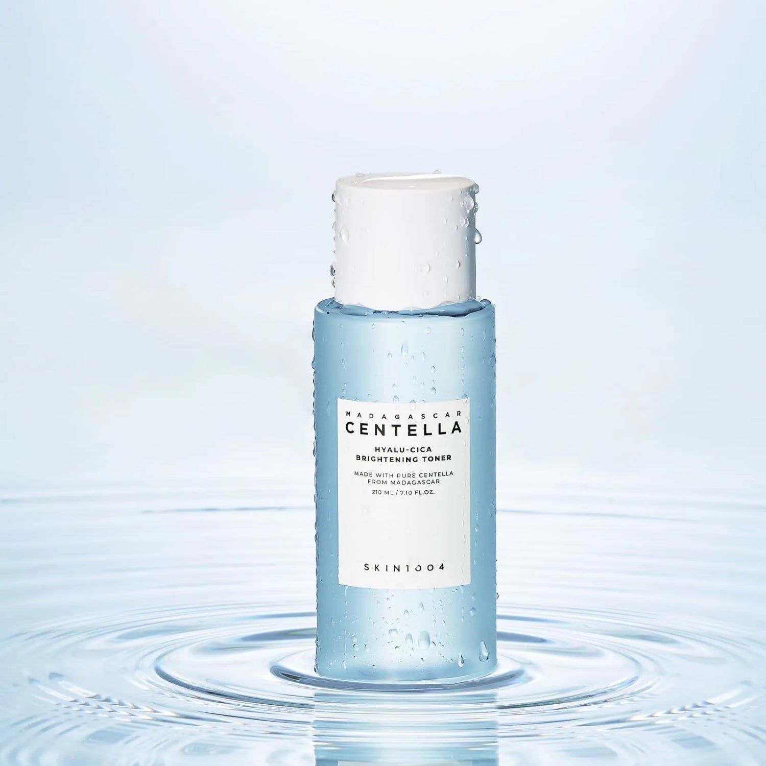 SKIN1004 Madagascar Centella Hyalu-Cica Radiance Toner 210ml bottle on water surface background