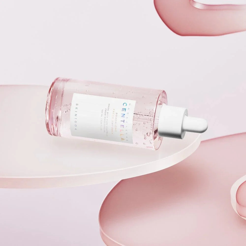 SKIN1004 Madagascar Centella Pore-Mfying Fresh Ampoule 100ml bottle displayed on white and pink background.