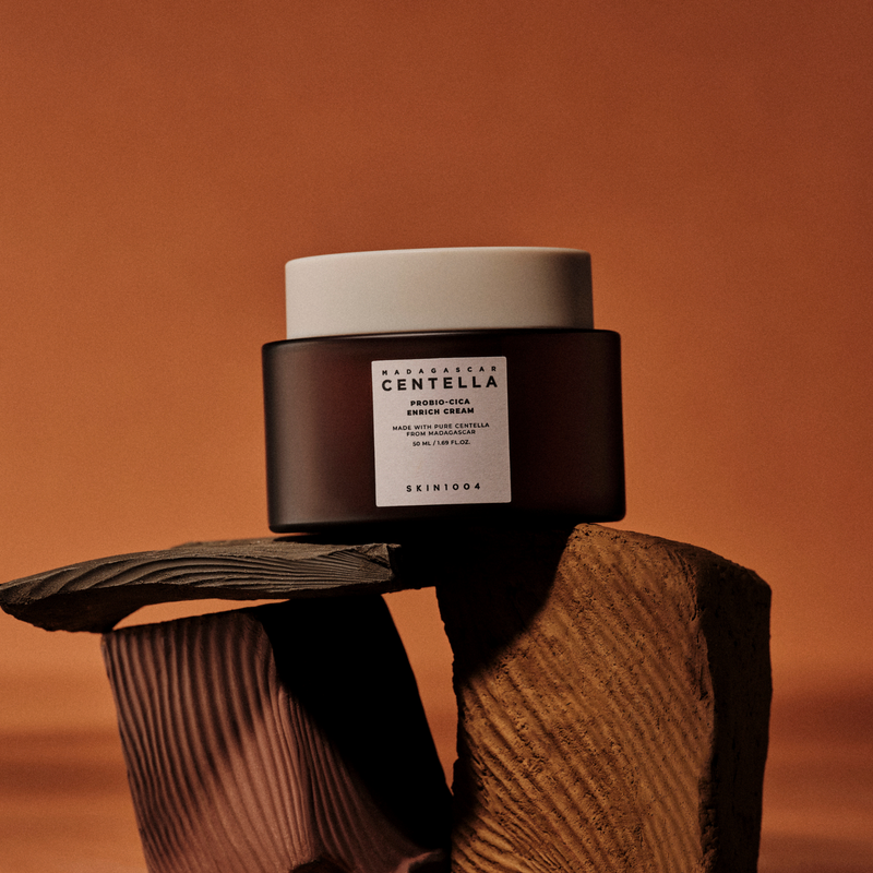 SKIN1004 Madagascar Centella Probio-cica Enrich Cream 50ml on textured brown background