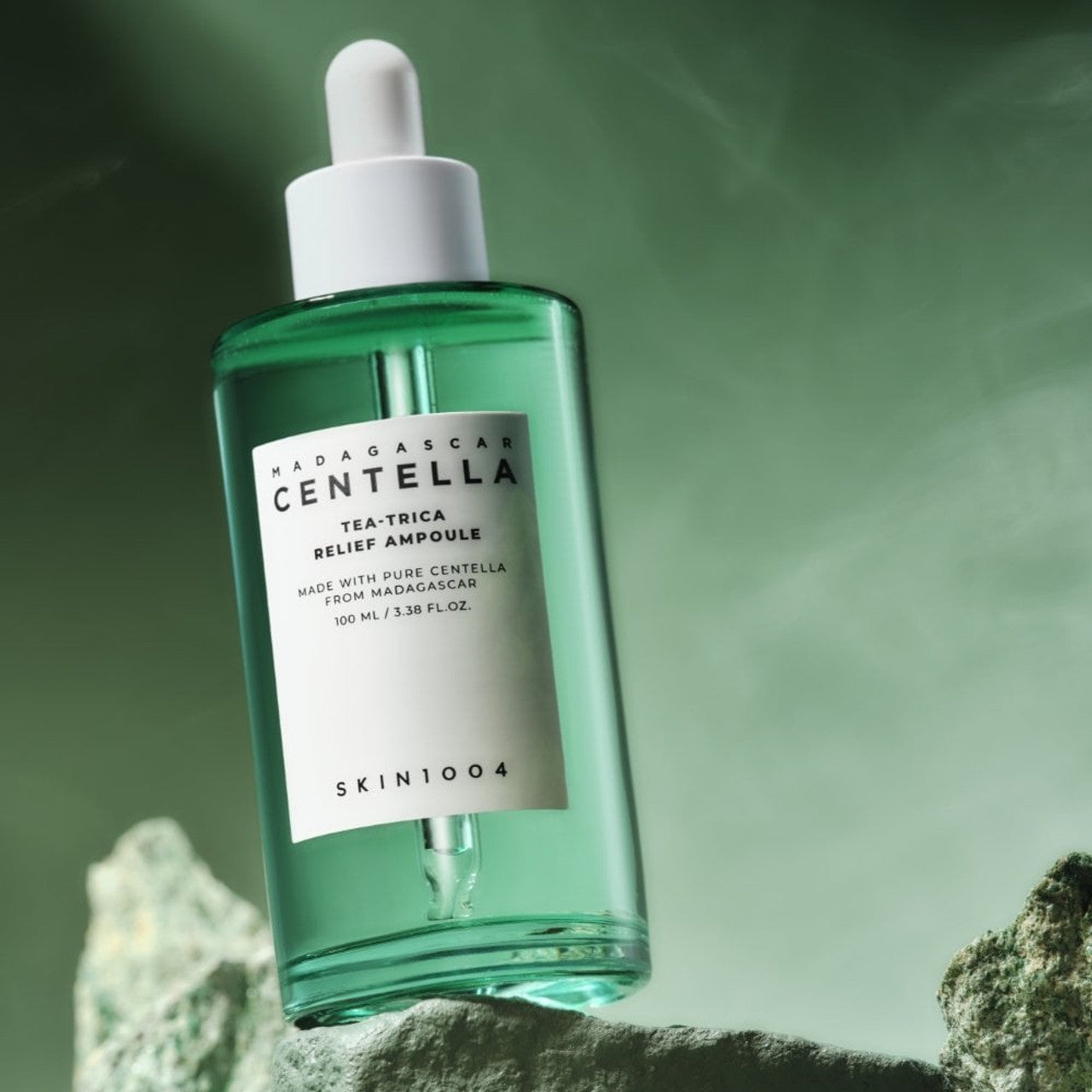 SKIN1004 Madagascar Centella Tea-trica Relief Ampoule 100ml bottle on a textured surface