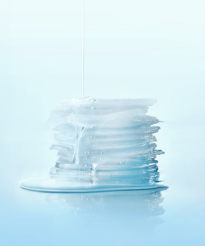 Stack of SKIN1004 Madagascar Centella-Hyalu-Cica Jelly Fit Ampoule Pads with serum on blue background.