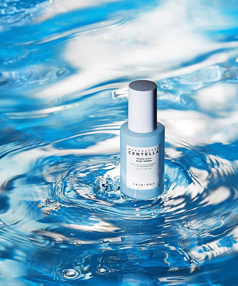 SKIN1004 Madagascar Centella Hyalu-Cica Blue Serum 50ml bottle on blue water background