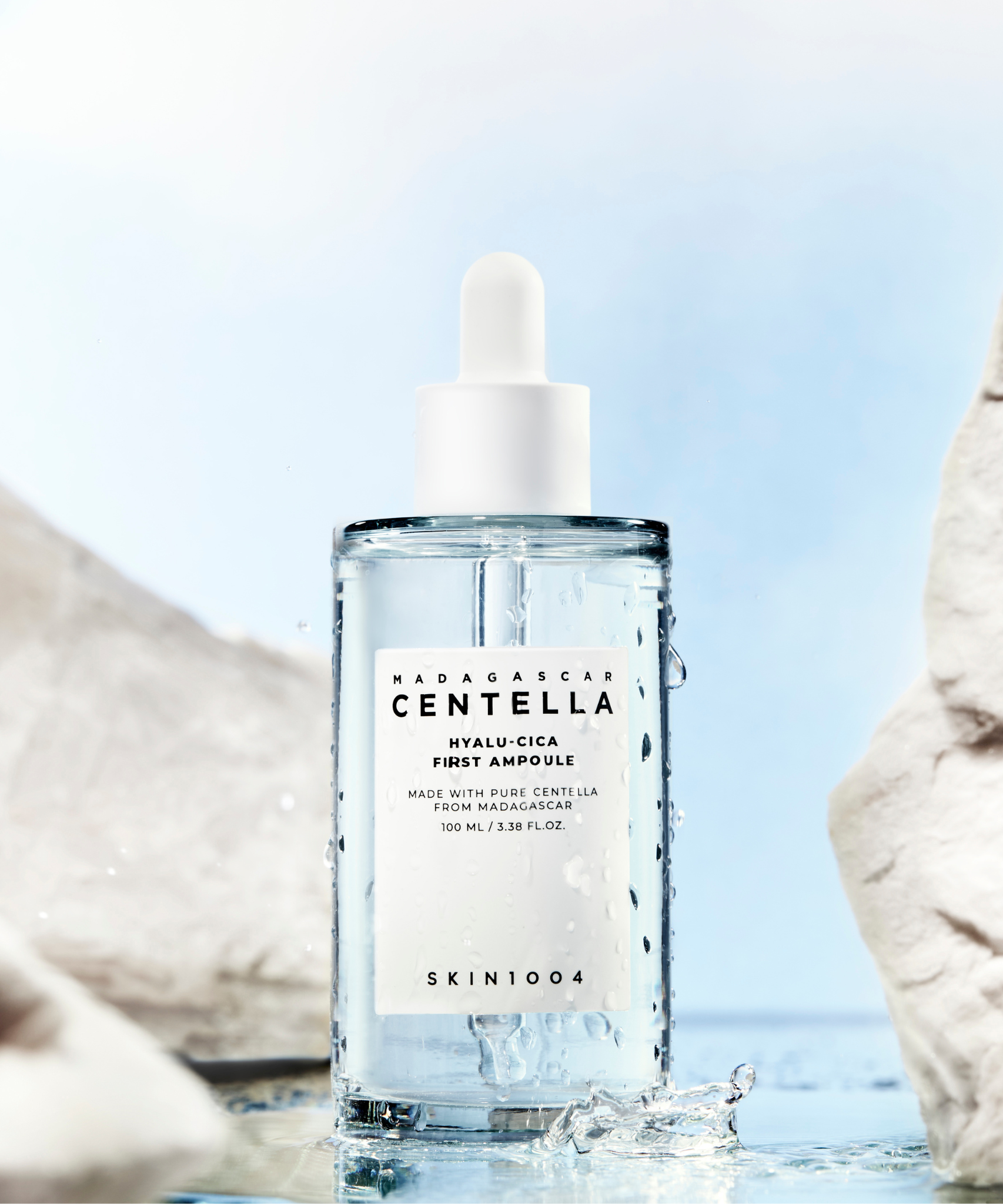 SKIN1004 Madagascar Centella Hyalu-Cica First Ampoule 100ml bottle displayed with water and rocks background