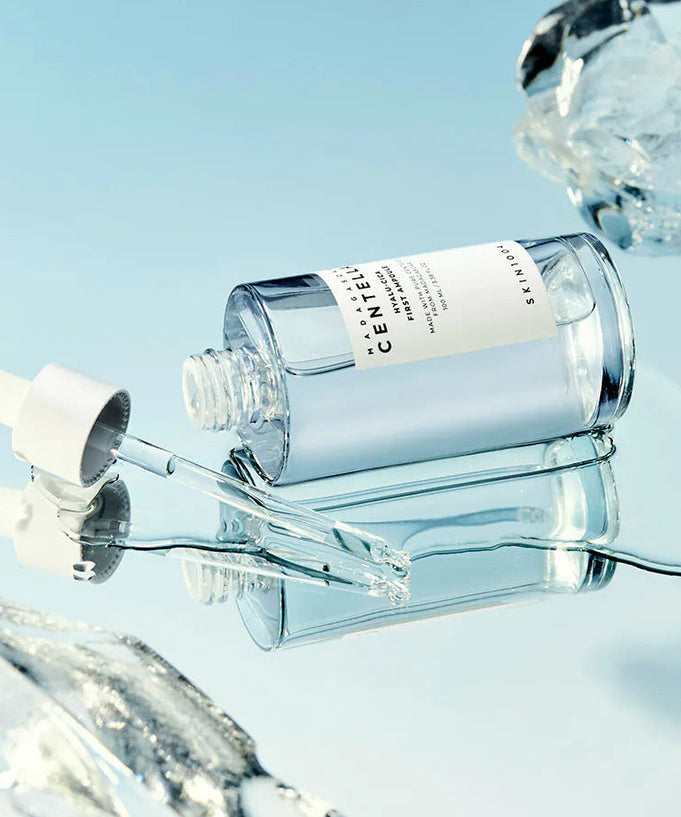 SKIN1004 Madagascar Centella Hyalu-Cica First Ampoule 100ml bottle with dropper on ice background
