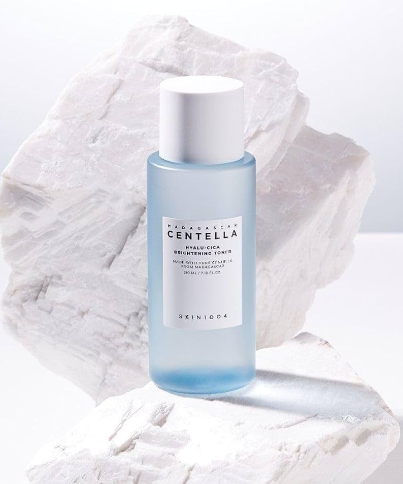 SKIN1004 Madagascar Centella Hyalu-Cica Radiance Toner 210ml bottle on white textured background
