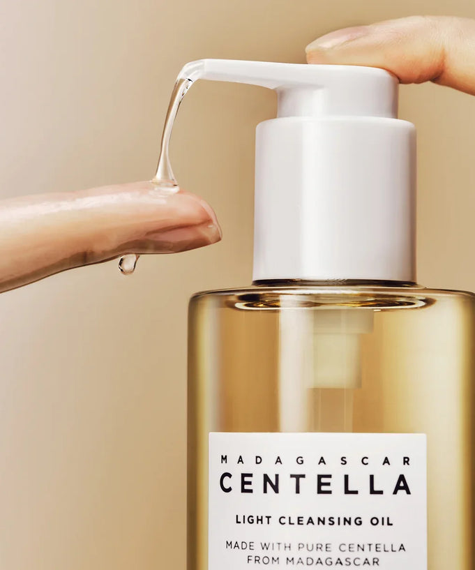 SKIN1004 Madagascar Centella Light Cleansing Oil 200ml bottle with pump dispensing oil on fingertip