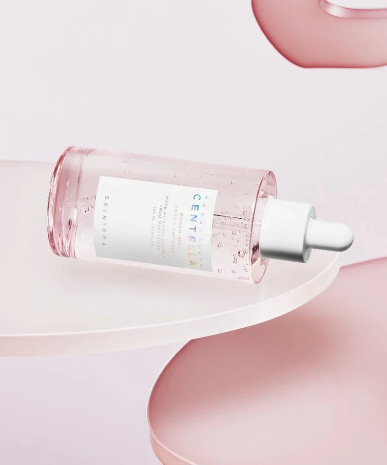 SKIN1004 Madagascar Centella Pore-Mfying Fresh Ampoule 100ml bottle displayed on white and pink background.